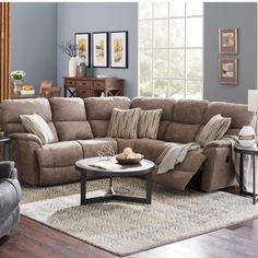 a living room with two recliners and a large sectional couch in the middle