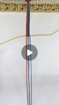 a video showing how to make a macrame bead necklace with beads and yarn