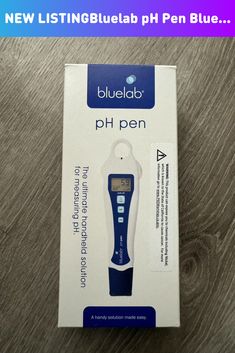 the bluelab ph pen is in its box on top of a wooden table with it's packaging