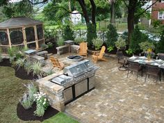 an outdoor kitchen and dining area is shown