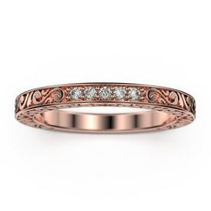 a rose gold wedding band with diamonds