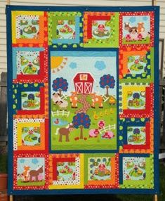 a colorful quilt with farm animals on it