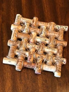 a bunch of wine corks sitting on top of a wooden table