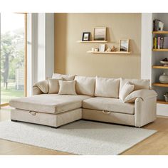 a living room scene with focus on the sectional sofa and storage unit in the background