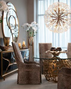 an elegant dining room with leopard print chairs