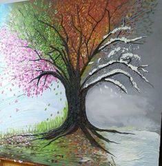 a painting of a tree with pink and green leaves