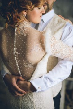 a bride and groom embracing each other