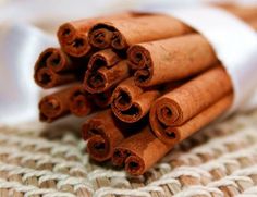 cinnamon sticks are stacked on top of each other