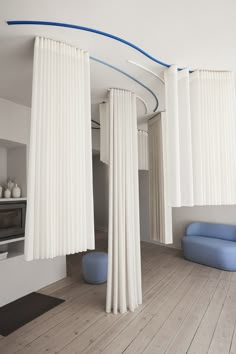 Blue and white ceiling mounted curtain tracks carrying white curtains. Curtain Room Dividers, Room Division, How To Hang Curtains, Curtain Divider, Interior Design Curtains, Curtain Room Divider, Curtain Tracks, Hang Curtains