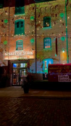 a brick building lit up with christmas lights