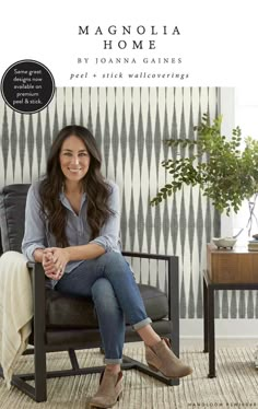 a woman sitting in a chair with her legs crossed, smiling and looking at the camera