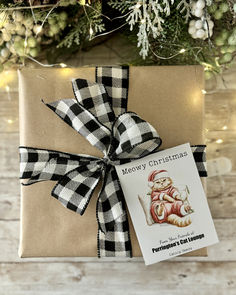 Illustration of a grumpy cat dressed up in Santa suit, propped against pillows with the headline, Meowy Christmas. Custom text can be added at the bottom of the seed packet. Creative Gift Tags, Christmas Kitty, Santa Claws, Cute Cat Illustration, Meowy Christmas, Custom Gift Tags, Seed Packets, Promotional Item, Gift List