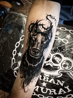 a man's leg with a tattoo on it and an image of a bear