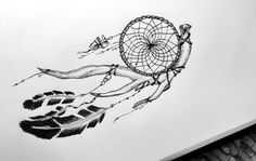 a drawing of a dream catcher on a piece of paper