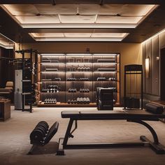 a gym with rows of exercise equipment in the center and lights above it, all lit up by recessed lighting