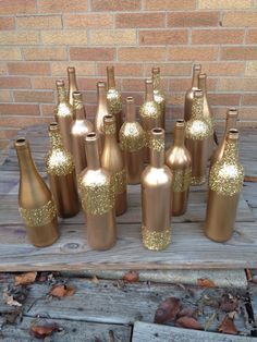 there are many bottles that have gold glitter on them