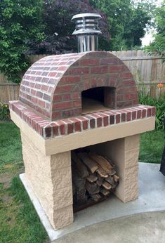 an outdoor brick pizza oven with logs in it