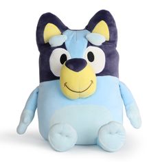 a blue and yellow stuffed animal with big eyes