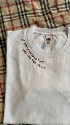 a white t - shirt that says i'm sorry to please