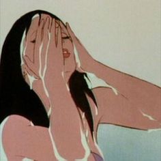 a woman covers her face with her hands