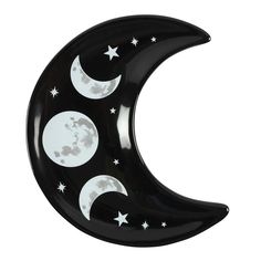 a black and white crescent shaped object with stars on the moon in the sky, against a white background