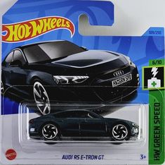 a black toy car is shown in the packaging for hot wheels, which has an emblem on it