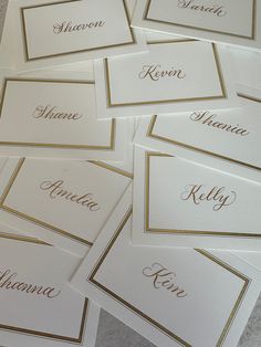 six place cards with names on them sitting on the floor