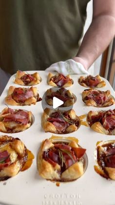 there are many small pastries on the tray