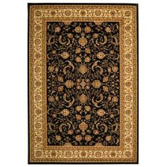 a black and gold rug with an ornate design on the bottom, in front of a white background