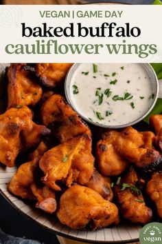 baked buffalo cauliflower wings on a plate with ranch dressing in the background and text vegan game day baked buffalo cauliflower wings