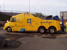 a large yellow truck parked in a parking lot