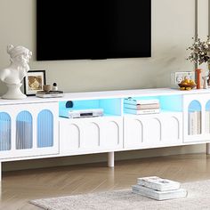 a white and blue entertainment center in a living room