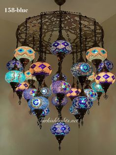 a chandelier with many colorful lights hanging from it