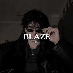 a man wearing sunglasses and a black jacket with the word blaze in front of him