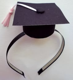 a graduation cap with a tassel hanging from it's side on a headband