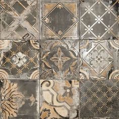 an old tile wall with different designs on it