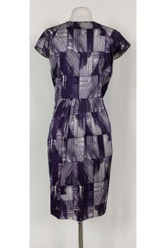 This pretty dress has a fun abstract print in a chic purple and white color. Cap sleeves, a plunging neckline and pleats along the waist all elevate this basic dress from Poleci. It can be dressed up or down for any occasion. Size 4 91% silk, 9% lycra V-neck Cap sleeves Side zipper Unlined Abstract print Bust 34.5" Waist 30" Shoulder to hem 39" Purple Lined Midi Length Dresses, Fitted Purple Printed Midi Dress, Fitted Purple Printed Dress, Purple Fitted Dress With Pleated Bodice, Spring Purple Lined Midi Dress, Elegant Fitted Pleated Dress With Floral Print, Fitted Purple Pleated Midi Dress, Chic Lined Purple Dress, Chic Purple Lined Dress