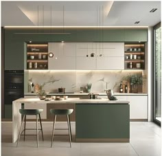 a modern kitchen with green and white cabinets, marble counter tops, and stools