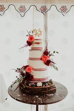 a wedding cake sitting on top of a table