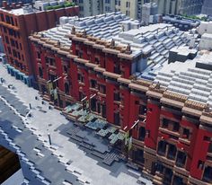 an aerial view of a red building in the city