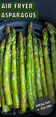 green asparagus in an air fryer with text overlay that reads, air fryer asparagus healthy and crispy