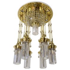 a gold chandelier with many crystal beads hanging from it's center point