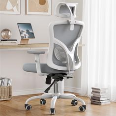 a white office chair sitting on top of a hard wood floor