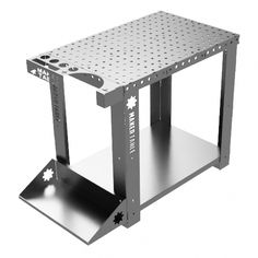 a metal table with holes on the top and one section open to show an object