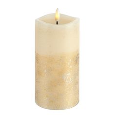 a white candle with gold flecks and a single lit candle in the middle