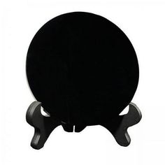 a black table top sitting on top of a metal stand