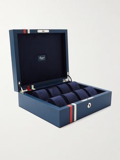 Your most prized timepieces deserve to be housed somewhere special. Offering space for up to eight watches, Rapport London's 'Greenwich' box is handcrafted from blue full-grain leather with red and white stripes that nod to the Union Jack. The plush suede interior and cushioned rolls keep every piece safe and secure. Rectangular Blue Watch Accessories For Gift, London Greenwich, Watch Box For Men, Leather Watch Roll, Mens Jewelry Box, Mens Watch Box, Leather Watch Box, Watch Roll, Watch Winder