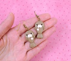 "Hi CutiePie, We're cute seal earrings. We're earrings created from polymer clay without using any molds and completely handmade. We can be a funny gift for people of all ages. We'll always cheers You up and will bring a smile on your face. Our dimensions are: Length 1.2\" ( or 3 cm. ) Width 0.8\" ( or 2 cm. ) But I can also be made as necklace, a brooch or a keychain. My dimensions as keychain: Length 1.4\" ( or 3.5 cm. ) Width 0.8\" ( or 2 cm. ) My dimensions as necklace: Length 1.4\" ( or 3.5 Seal Earrings, Seal Jewelry, Lion Earrings, White Seal, Sea Earrings, Cute Seals, Cute Donuts, Paper Earrings, Miniature Animals