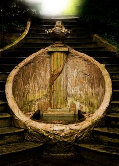 an old wooden boat sitting on top of some steps