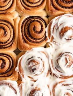 several cinnamon rolls with icing on top of each one